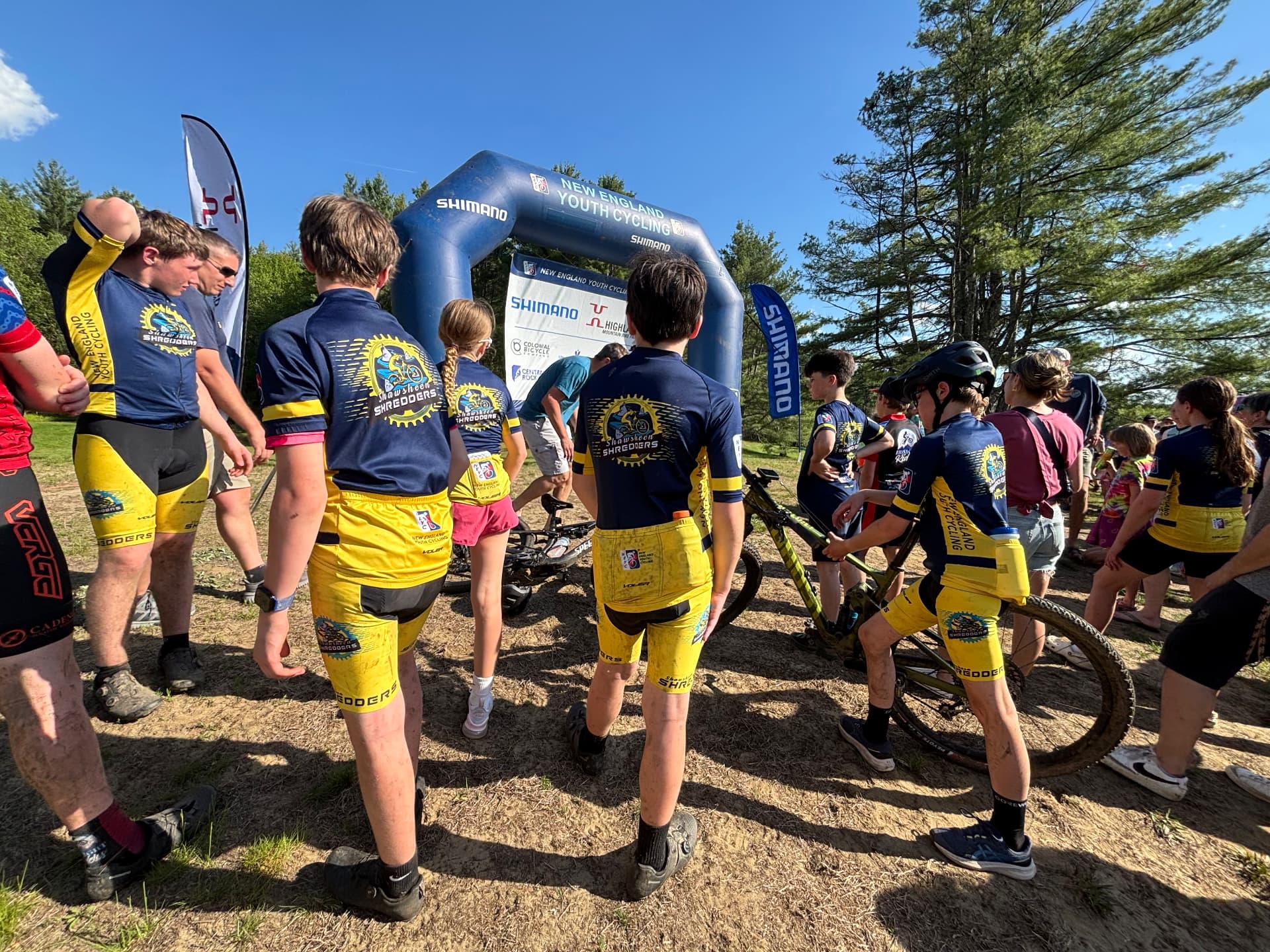 Shredders riders lined up at the start gate of a race