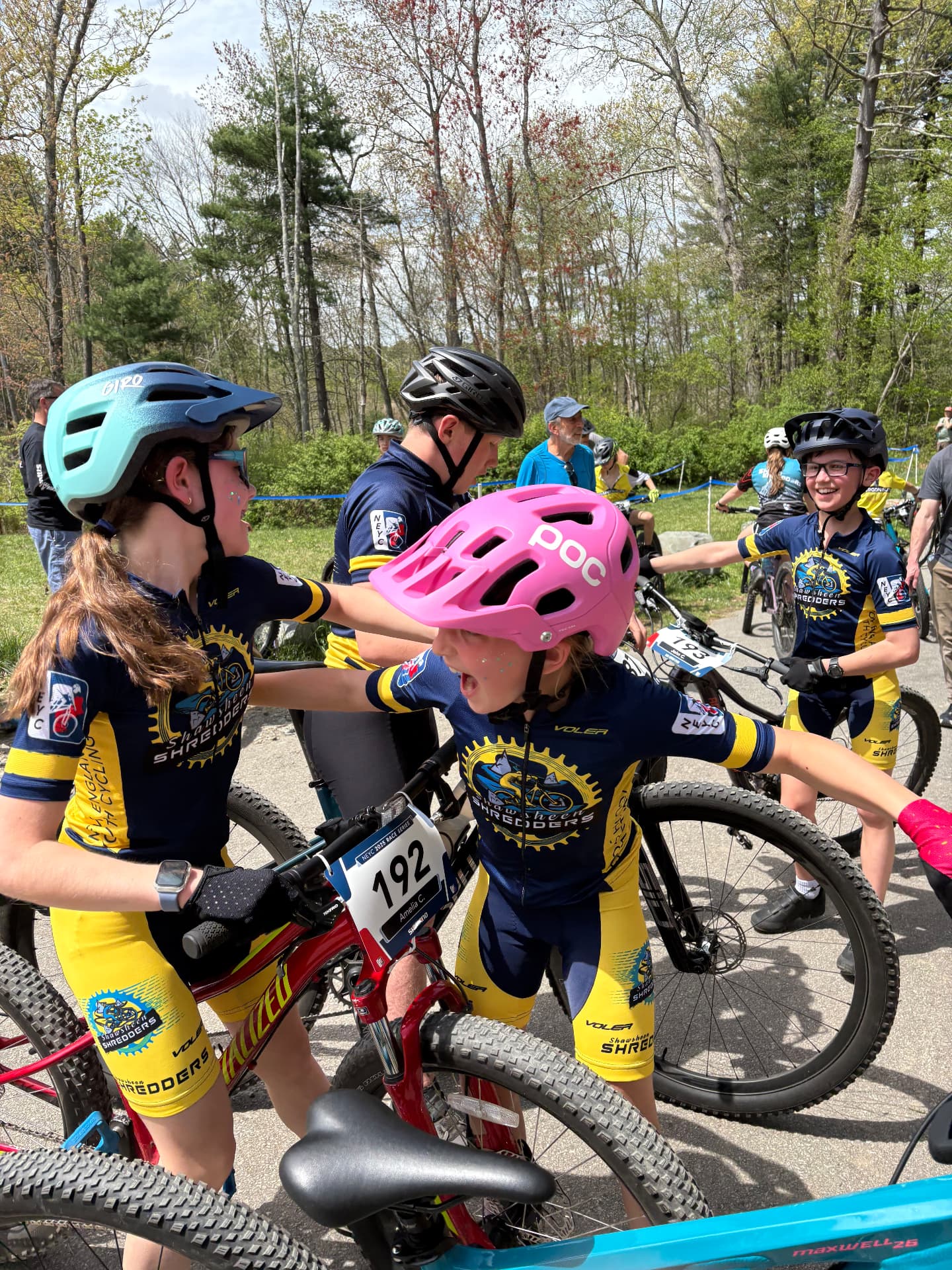 Shredders riders cheering and high-fiving at the race start