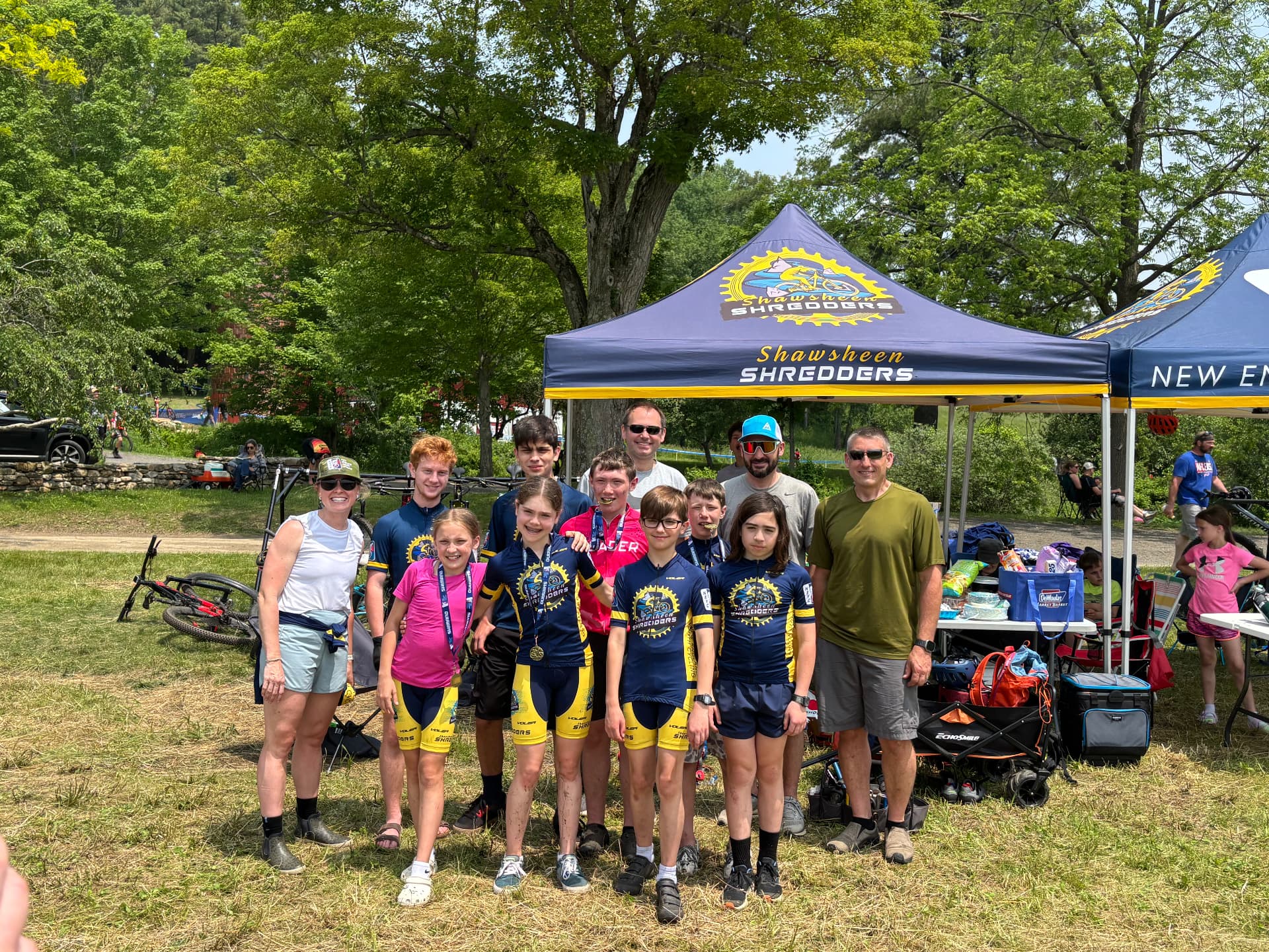 The Shredders team and coaches gathered under the team tent