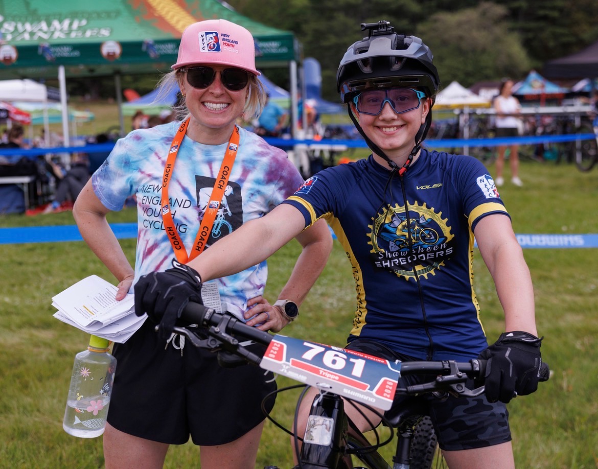 A coach cheering with a Shredders rider at the start line